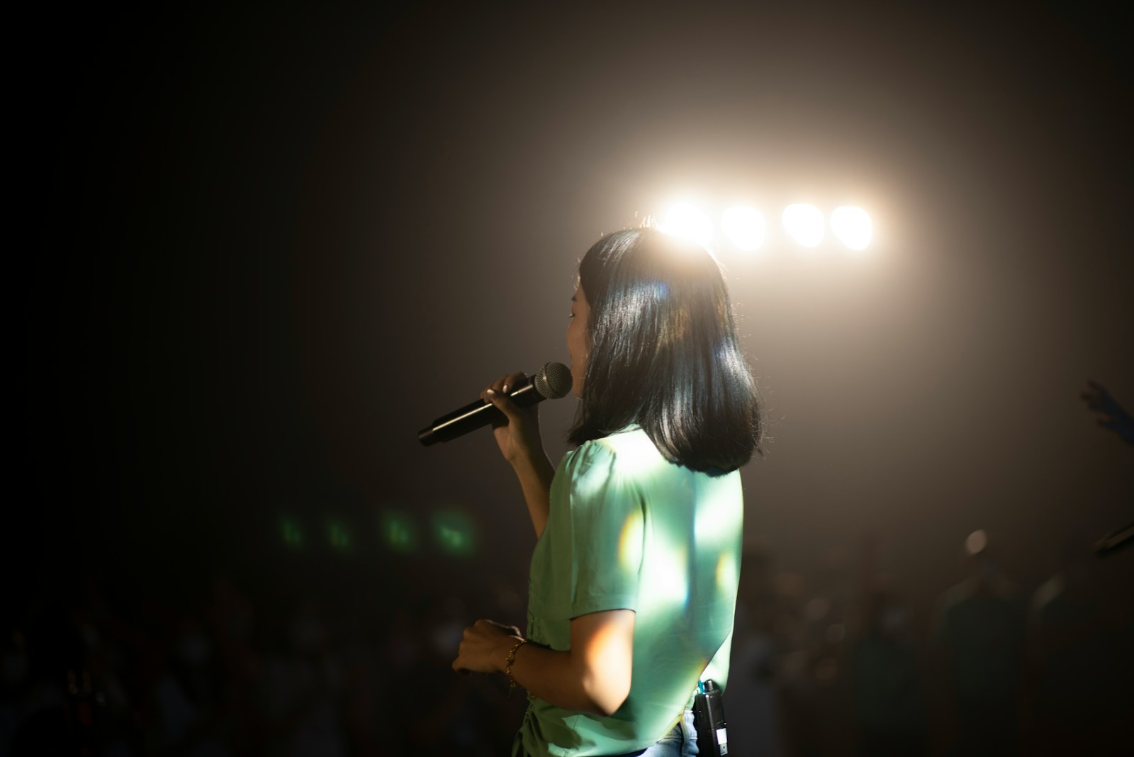 a person singing into a microphone
