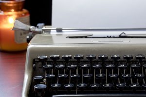 An old typewriter and candle - a special writing place