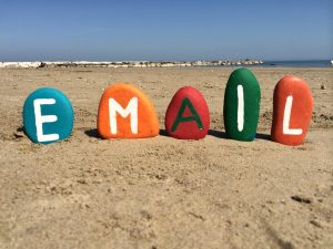 Email written in colorful paints on stones