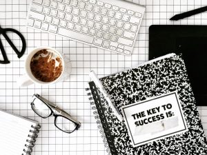 Coffee, notebook, and glasses