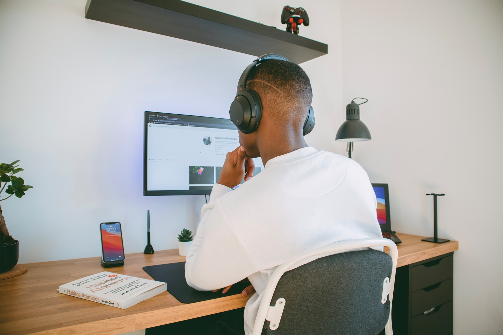 man in white shirt focused on his work