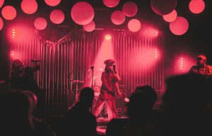 woman singing on stage